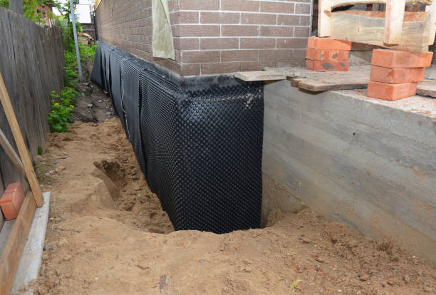 Happy homeowners after waterproofing job in Cascade